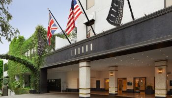 The London West Hollywood at Beverly Hills entrance. Gay-friendly hotel with flags. Luxury travel for gay men in West Hollywood, California.