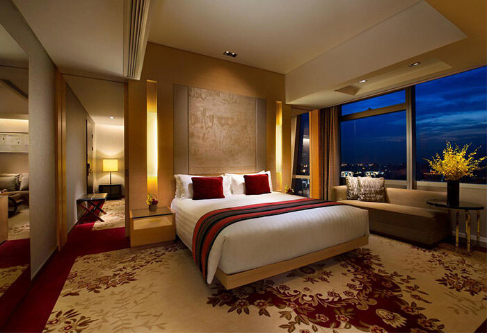 The Longemont Shanghai Hotel room. Gay-friendly hotel featuring a king bed, city views, & modern decor. Perfect for gay travelers in Shanghai.
