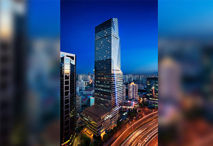 The Longemont Shanghai Hotel at night. Gay-friendly hotel in Shanghai with modern architecture and city views. Perfect for gay travelers seeking luxury.