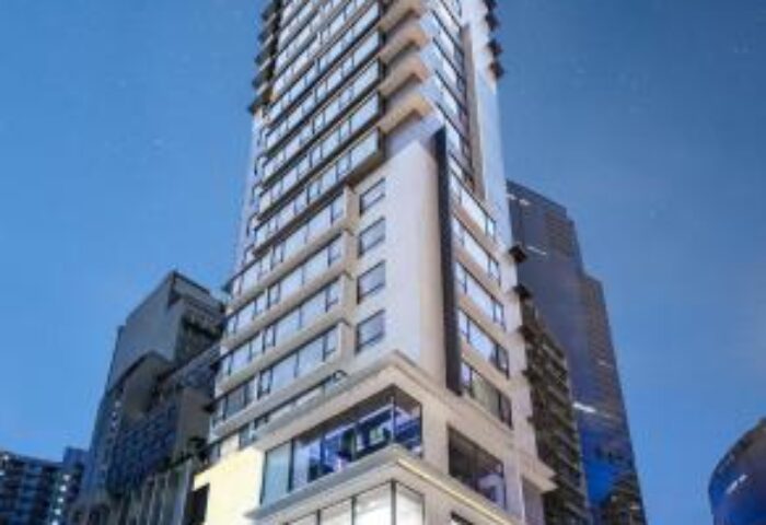 The Mercer Hong Kong, a gay-friendly hotel. Tall building with many windows and balconies. Modern architecture in Hong Kong's city center.