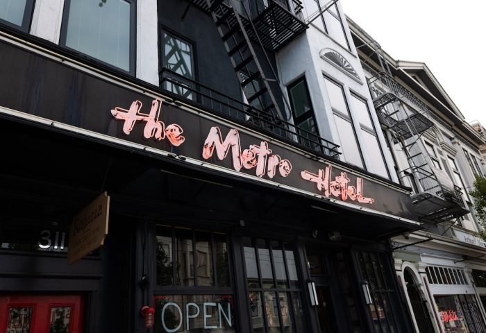 The Metro Hotel exterior. Gay-friendly hotel with neon sign. A great choice for gay men's travel.