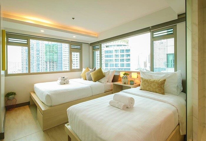 The Mini Suites Eton Tower Makati: Gay-friendly hotel room with twin beds, city view. Modern design, comfortable stay in Makati for gay travelers.