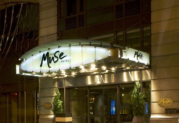 The Muse Hotel New York entrance at night. A gay-friendly hotel offering luxury accommodations in NYC for gay travelers.