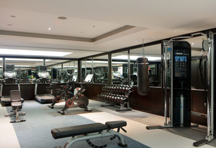 Gym at The Muse New York, a gay-friendly hotel. Treadmills, bikes, weights, and punching bag. Fitness center for gay travelers in NYC.