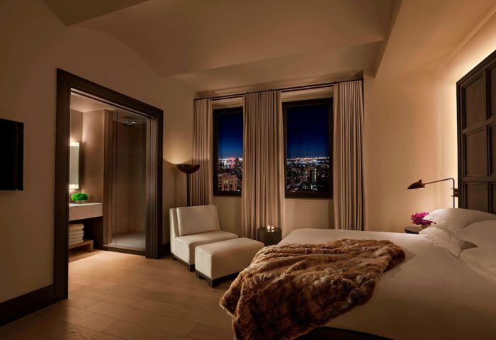 The New York EDITION hotel room. Gay-friendly hotel with city views, a plush bed, and a modern bathroom. Luxury travel for gay men.