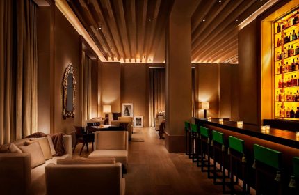 Gay-Friendly Hotel, The New York EDITION: Stylish lounge area with seating, bar, and warm lighting. A great choice for gay travelers.