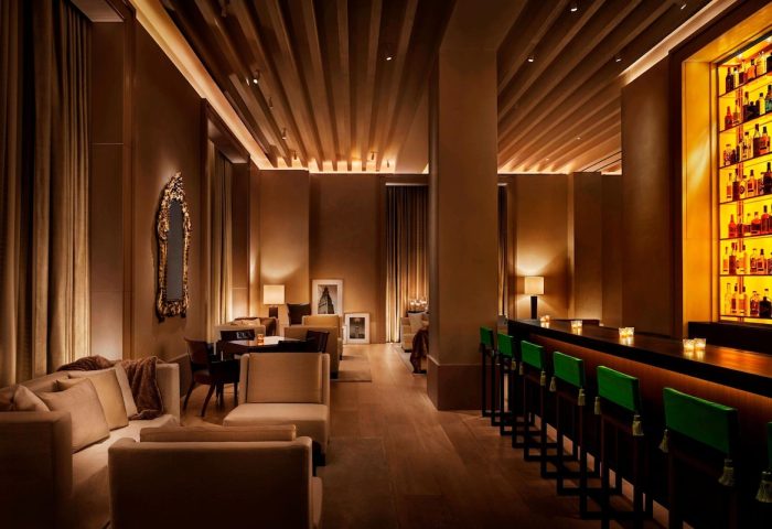 Gay-Friendly Hotel, The New York EDITION: Stylish lounge area with seating, bar, and warm lighting. A great choice for gay travelers.