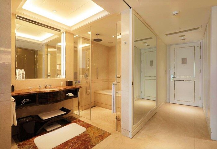 Bathroom at The Okura Prestige Taipei Hotel. Gay-friendly hotel with shower, tub, sink, and vanity. Luxury travel for gay men in Taipei.