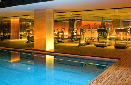The Opposite House Hotel gym and pool. Gay-friendly hotel featuring modern fitness equipment and a swimming pool for a relaxing workout.