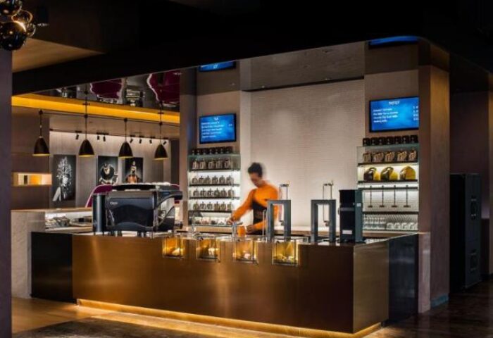 Bar at The Park Lane Hong Kong a Pullman Hotel, a gay-friendly hotel. Barista mixing a drink. A great place for gay men to stay in Hong Kong.