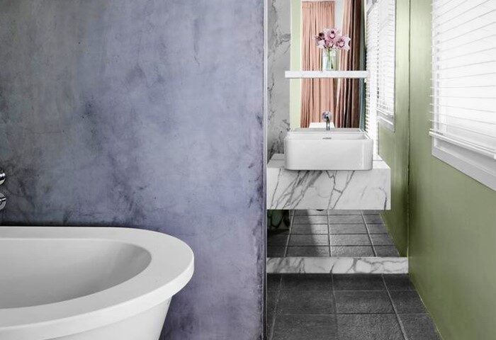 Bathroom at The Prince Hotel, a gay-friendly hotel. Features a modern sink, marble counter, bathtub, and stylish decor. Great for gay travel.