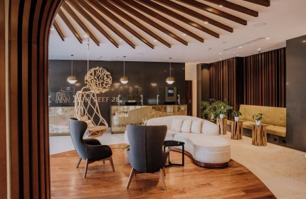 The Reef 28 Hotel & Spa lobby. Luxury adults-only all-suites hotel interior. Gay-friendly travel destination with optional all-inclusive.