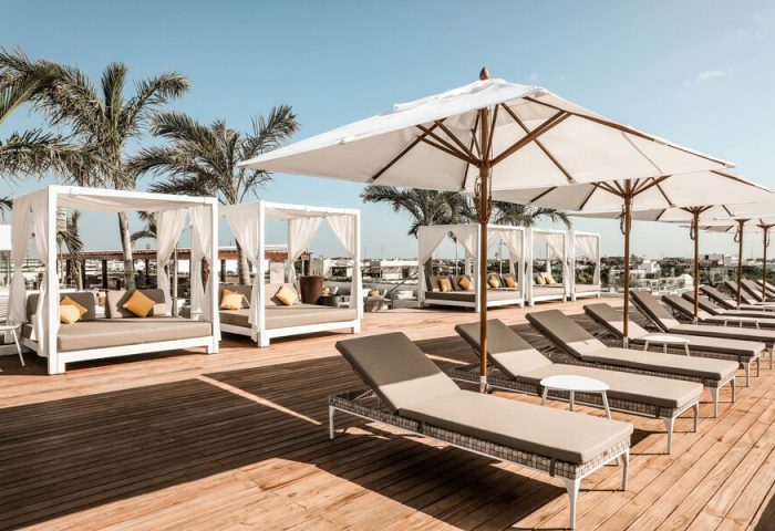 The Reef 28 Hotel & Spa rooftop pool area. Luxury adults-only all-suites resort with optional all-inclusive for gay travelers.