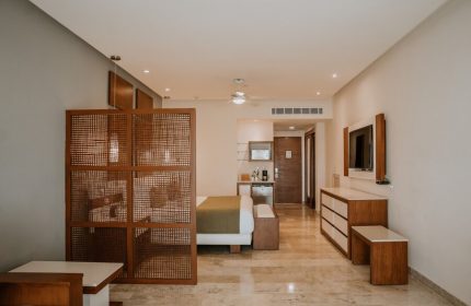 The Reef 28 Hotel & Spa suite interior. Luxury adults-only, all-inclusive option. Gay-friendly hotel room with modern design.