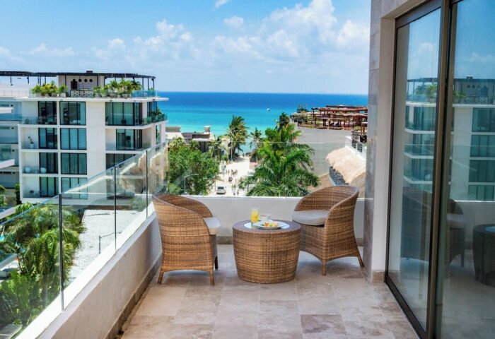 The Reef 28 Hotel & Spa balcony view. Luxury adults-only all-inclusive suites. Gay-friendly hotel with ocean view. Relaxing vacation.