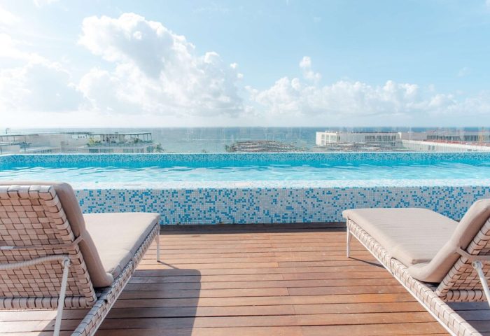 Rooftop pool at The Reef 28 Hotel & Spa, a luxury adults-only all-suites hotel with optional all-inclusive packages; gay-friendly resort.