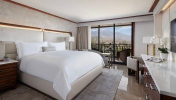 Gay-friendly hotel The Ritz-Carlton, Rancho Mirage: Luxurious room with balcony view. Upscale travel for gay men seeking comfort and style.
