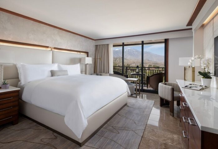 Gay-friendly hotel The Ritz-Carlton, Rancho Mirage: Luxurious room with balcony view. Upscale travel for gay men seeking comfort and style.