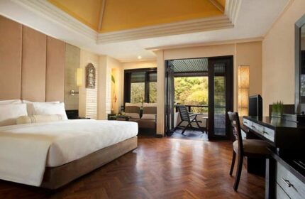 The Royal Beach Seminyak Bali MGallery Collection gay-friendly hotel room. Balcony view, desk, and king-size bed. Luxury Bali travel.