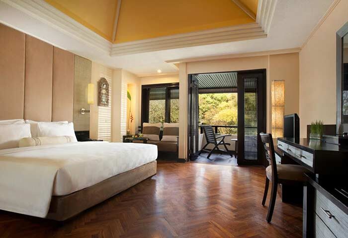 The Royal Beach Seminyak Bali MGallery Collection gay-friendly hotel room. Balcony view, desk, and king-size bed. Luxury Bali travel.