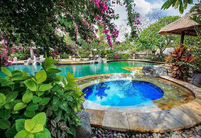 The Royal Beach Seminyak Bali MGallery Collection pool. Gay-friendly hotel with lush tropical gardens and inviting blue water.