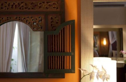 Detail of a mirror at The Royal Beach Seminyak Bali MGallery Collection, a gay-friendly hotel. Decorative Balinese design.
