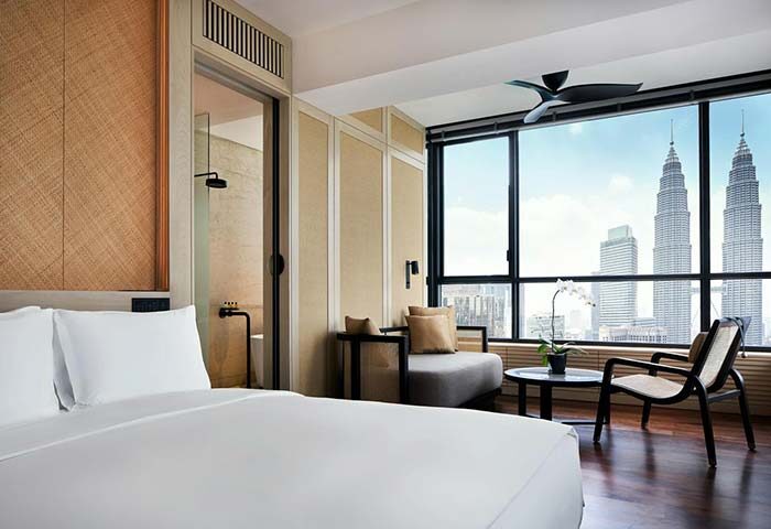 Gay-friendly The RuMa Hotel and Residences room. View of Petronas Towers. Luxury hotel for gay men travelers in Kuala Lumpur.