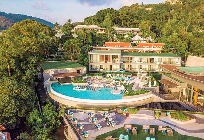 Aerial view of The SIS Kata Resort, a gay-friendly hotel. Pool, dining, and lush greenery. Kata, Phuket, Thailand. Gay travel.