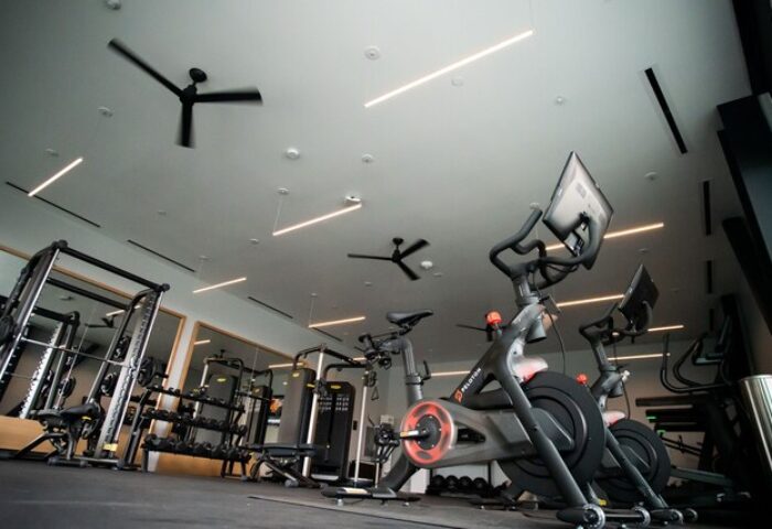 The Shay, A Destination By Hyatt Hotel gym. Peloton bikes, weights, and machines. Gay-friendly hotel fitness center. Modern design.