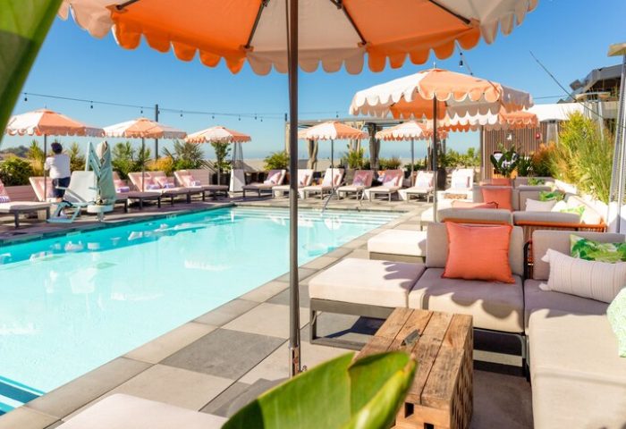 The Shay, A Destination By Hyatt Hotel's stylish pool area. This gay-friendly hotel features lounge chairs, umbrellas, and a chic design.