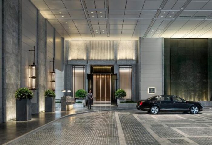 The St. Regis Hong Kong entrance. Gay-friendly hotel with luxury car, doorman, and elegant design. A top choice for gay travelers.