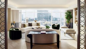 Luxury suite at The St. Regis Mexico City, a gay-friendly hotel. Modern design, city view, seating area, and stylish decor. Upscale travel.