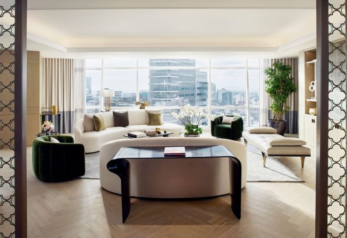 Luxury suite at The St. Regis Mexico City, a gay-friendly hotel. Modern design, city view, seating area, and stylish decor. Upscale travel.