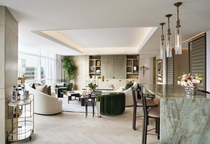 St. Regis Mexico City suite. Upscale gay-friendly hotel living room with bar, neutral tones, and modern design. Luxury Mexico City travel.