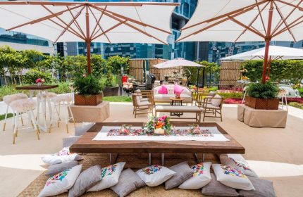 The St. Regis Mexico City gay-friendly hotel outdoor space. Lounge seating, pillows, umbrellas, and tables create a welcoming atmosphere.