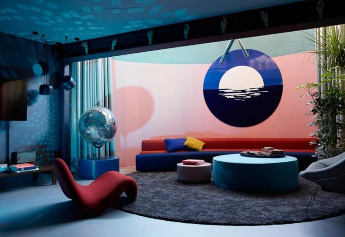 The Student Hotel Amsterdam City lounge area. Gay-friendly hotel with colorful decor, disco ball, and unique design elements. #AmsterdamHotel
