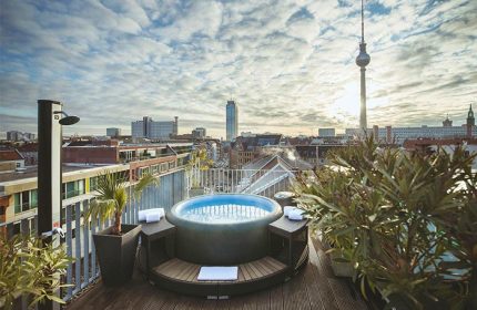 Rooftop jacuzzi with Berlin skyline at The Weinmeister Berlin-Mitte, an adults-only, gay-friendly, pet-friendly hotel.