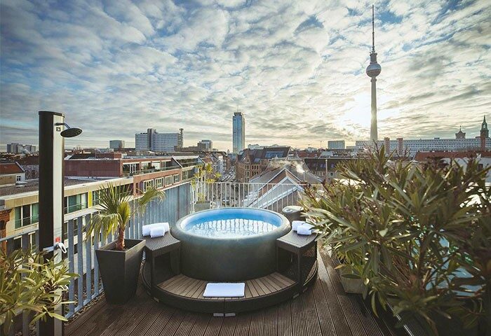 Rooftop jacuzzi with Berlin skyline at The Weinmeister Berlin-Mitte, an adults-only, gay-friendly, pet-friendly hotel.