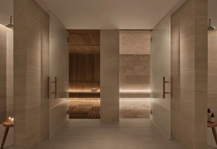 Sauna and steam room at The West Hollywood EDITION, a gay-friendly hotel. Modern design with wood and stone. Ideal for gay travel.