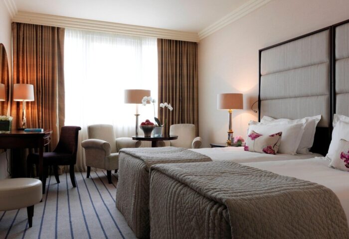 The Westbury Hotel's gay-friendly rooms feature twin beds, armchairs, and a desk. A luxury stay for gay travelers.