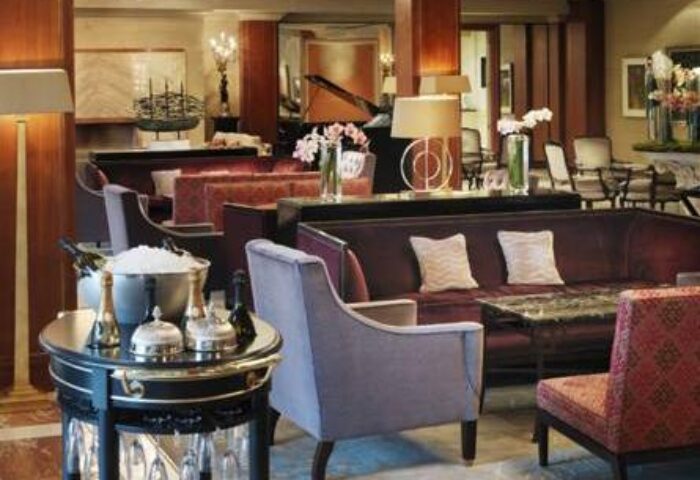 The Westbury Hotel's stylish lounge area. This gay-friendly hotel features plush seating, champagne, and an elegant ambiance for discerning travelers.