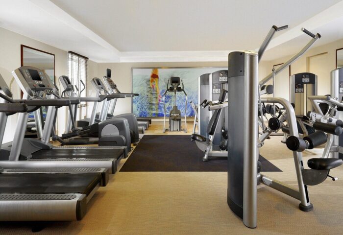 Gym at The Westin Grand Frankfurt, a gay-friendly hotel. Treadmills, elliptical machines, and weight machines. Fitness center, workout.