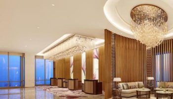 The Westin Jakarta lobby. Gay-friendly hotel features elegant chandeliers, modern decor, and comfortable seating areas. Luxury travel in Jakarta.
