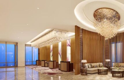 The Westin Jakarta lobby. Gay-friendly hotel features elegant chandeliers, modern decor, and comfortable seating areas. Luxury travel in Jakarta.