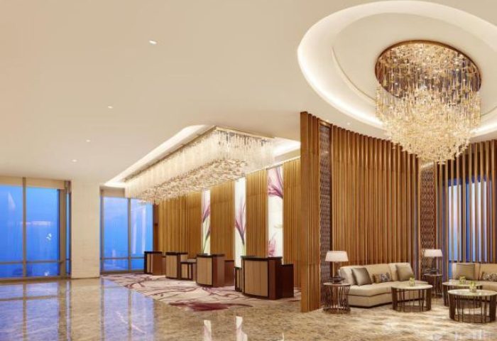 The Westin Jakarta lobby. Gay-friendly hotel features elegant chandeliers, modern decor, and comfortable seating areas. Luxury travel in Jakarta.