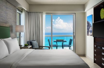 Bedroom at The Westin Lagunamar Ocean Resort Villas & Spa Cancun. Balcony with ocean view. Gay-friendly hotel in Cancun.