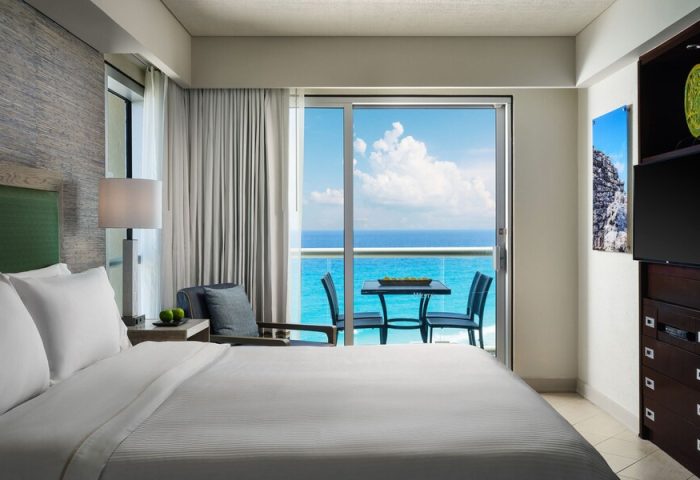 Bedroom at The Westin Lagunamar Ocean Resort Villas & Spa Cancun. Balcony with ocean view. Gay-friendly hotel in Cancun.