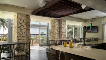 Bar view at The Westin Lagunamar Ocean Resort Villas & Spa Cancun. Gay-friendly hotel with ocean view. Mugs of beer on the bar top.
