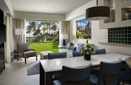 The Westin Lagunamar Ocean Resort Villas & Spa Cancun suite. Gay-friendly hotel with ocean view, dining table, and living area.