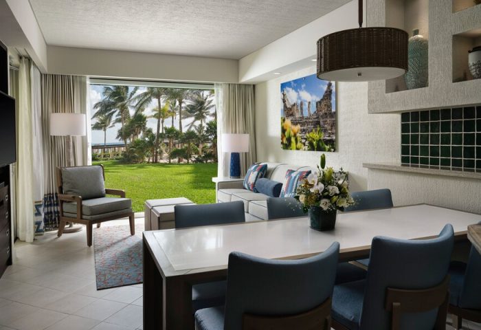 The Westin Lagunamar Ocean Resort Villas & Spa Cancun suite. Gay-friendly hotel with ocean view, dining table, and living area.